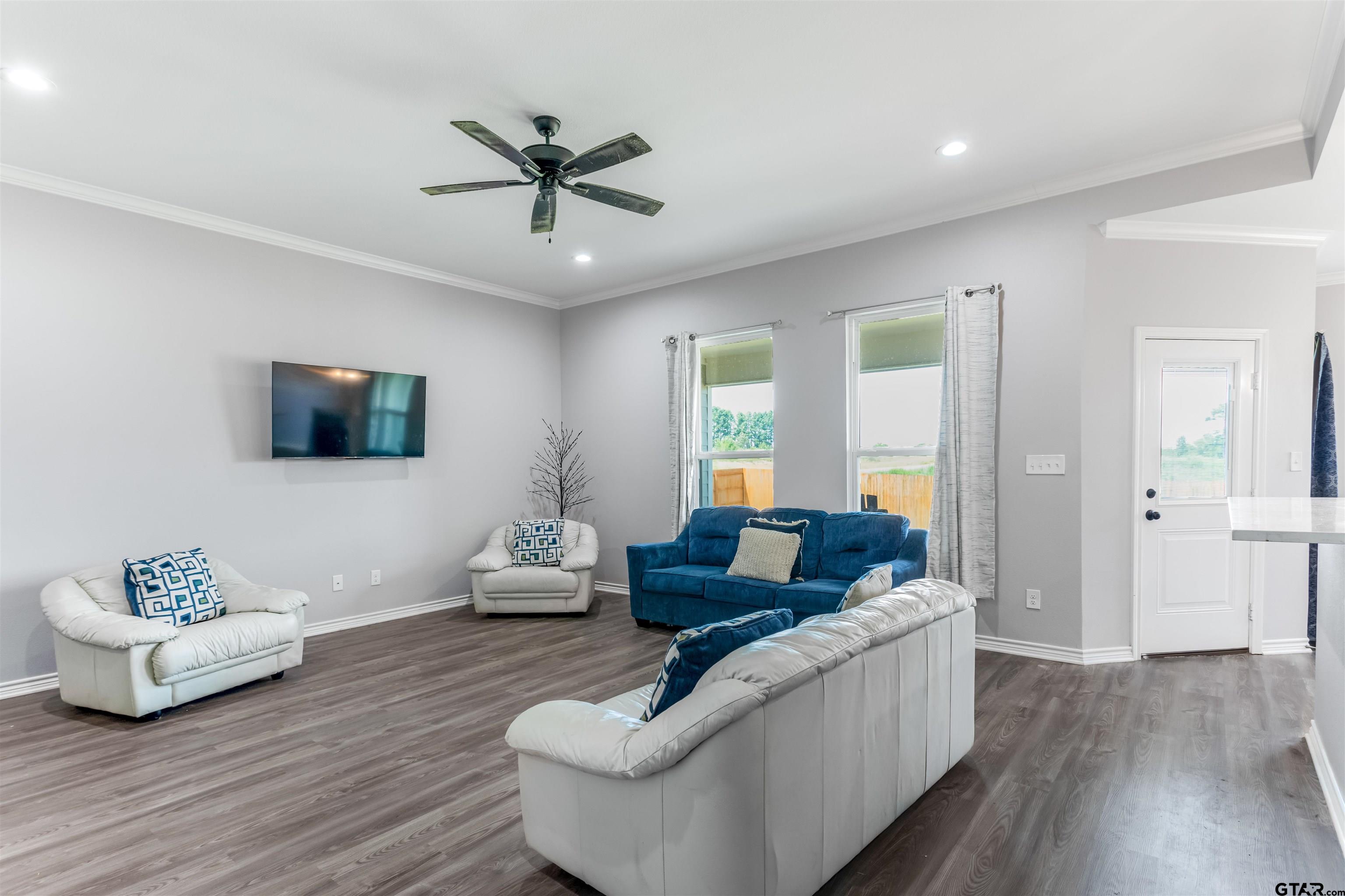 12908 County Road 46 Tyler, TX 75704 - Photo 5 of 20 a living room with furniture and a wooden floor