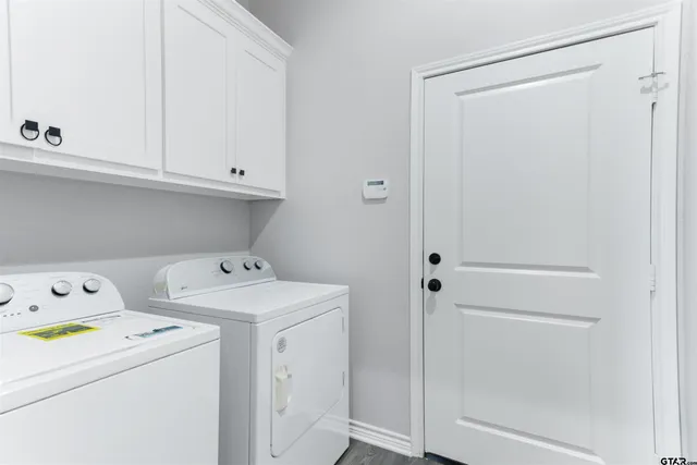 a view of storage and utility room with washer and dryer