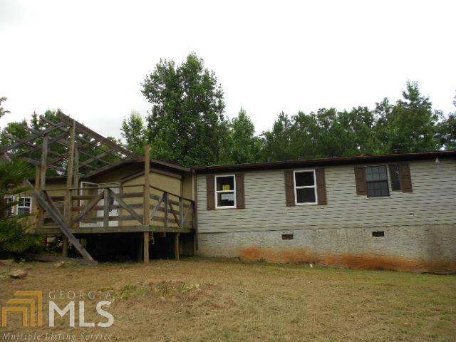 1323 City Pond Road Barnesville, GA 30204 - Photo 1 of 1 a view of a house with a backyard