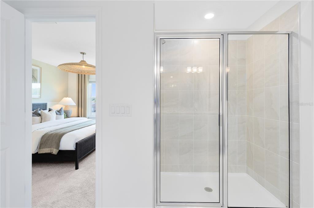 4309 Jetty Lane Palm Bay, FL 32905 - Photo 17 of 28 a bathroom with a bathtub and a shower