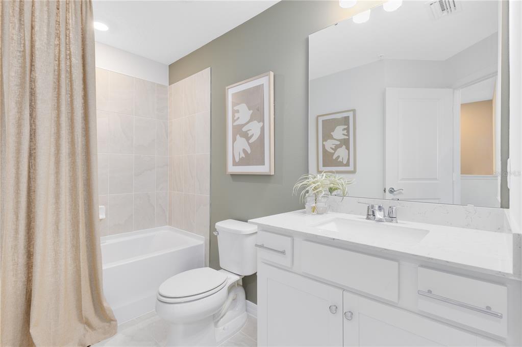 4309 Jetty Lane Palm Bay, FL 32905 - Photo 23 of 28 a bathroom with a sink toilet tub and shower