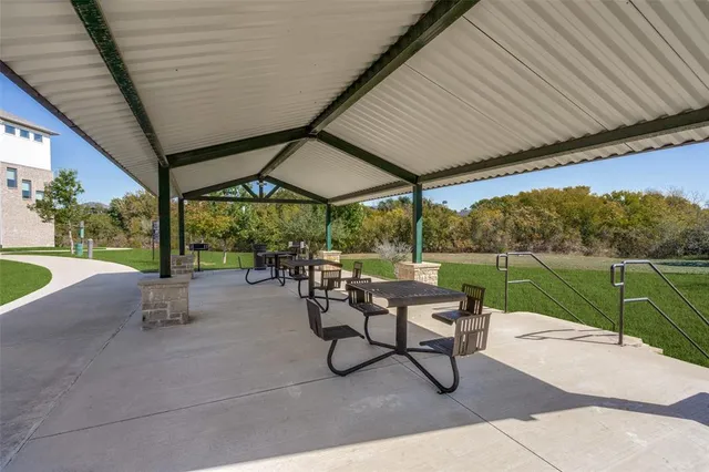 a patio with yard table and chairs