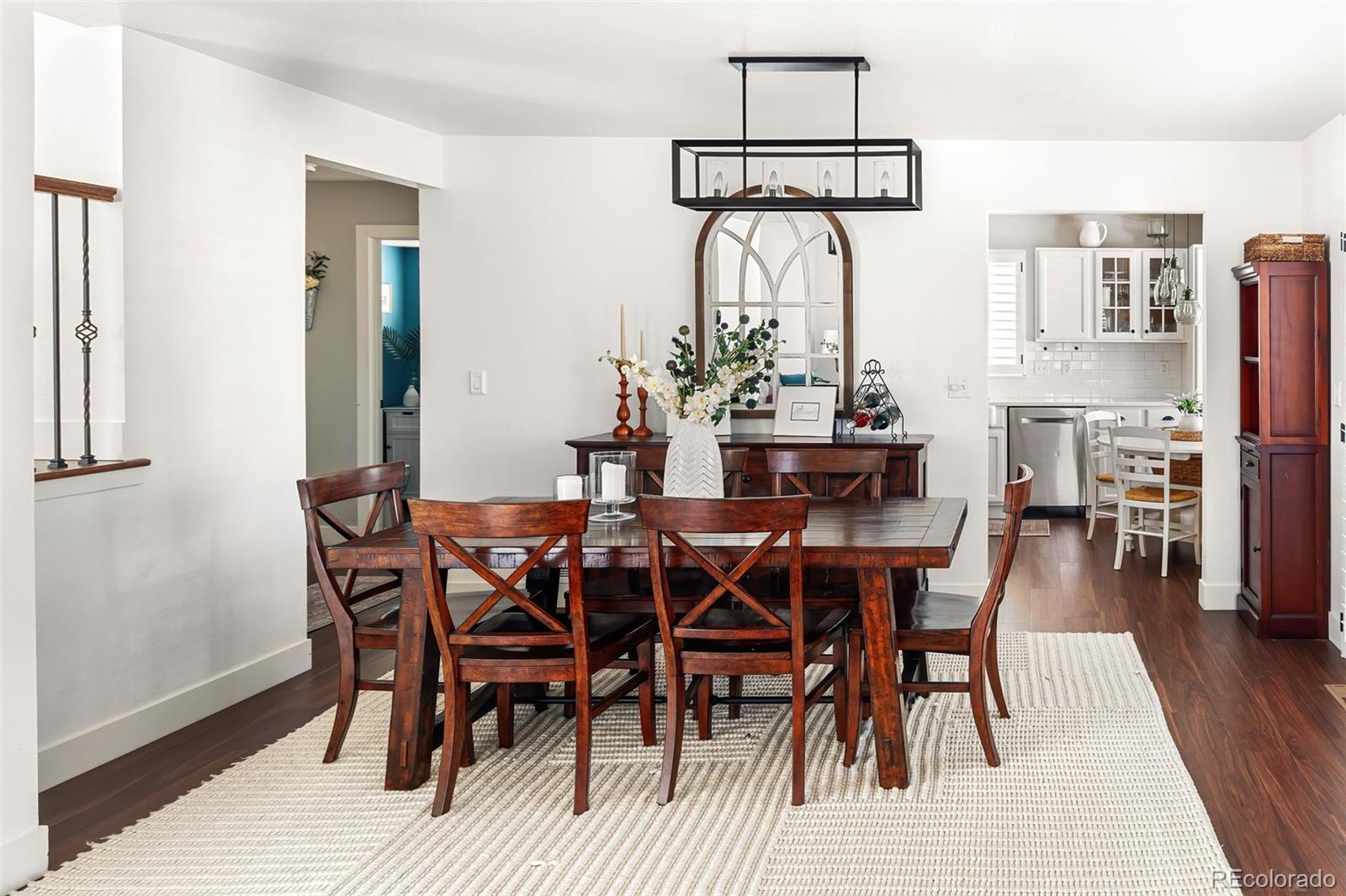 7255 West 97th Place Broomfield, CO 80021 - Photo 15 of 47 a view of a dining room with furniture and wooden floor