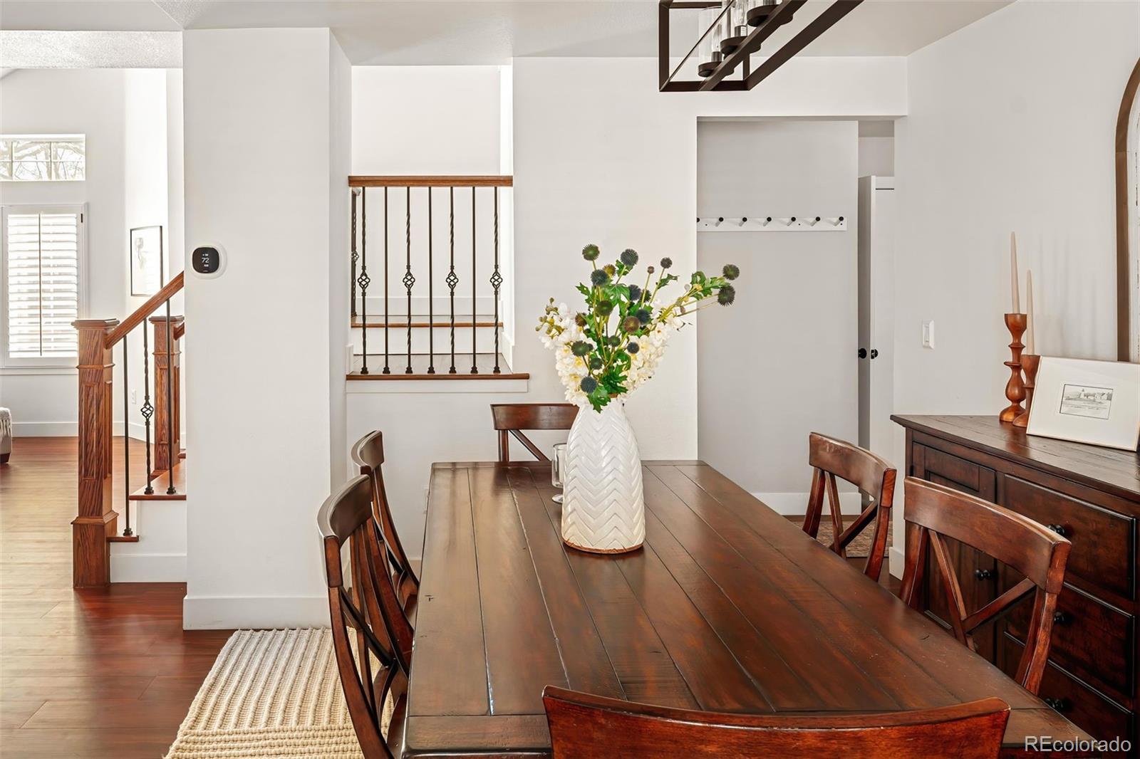 7255 West 97th Place Broomfield, CO 80021 - Photo 16 of 47 a dining room with furniture and wooden floor