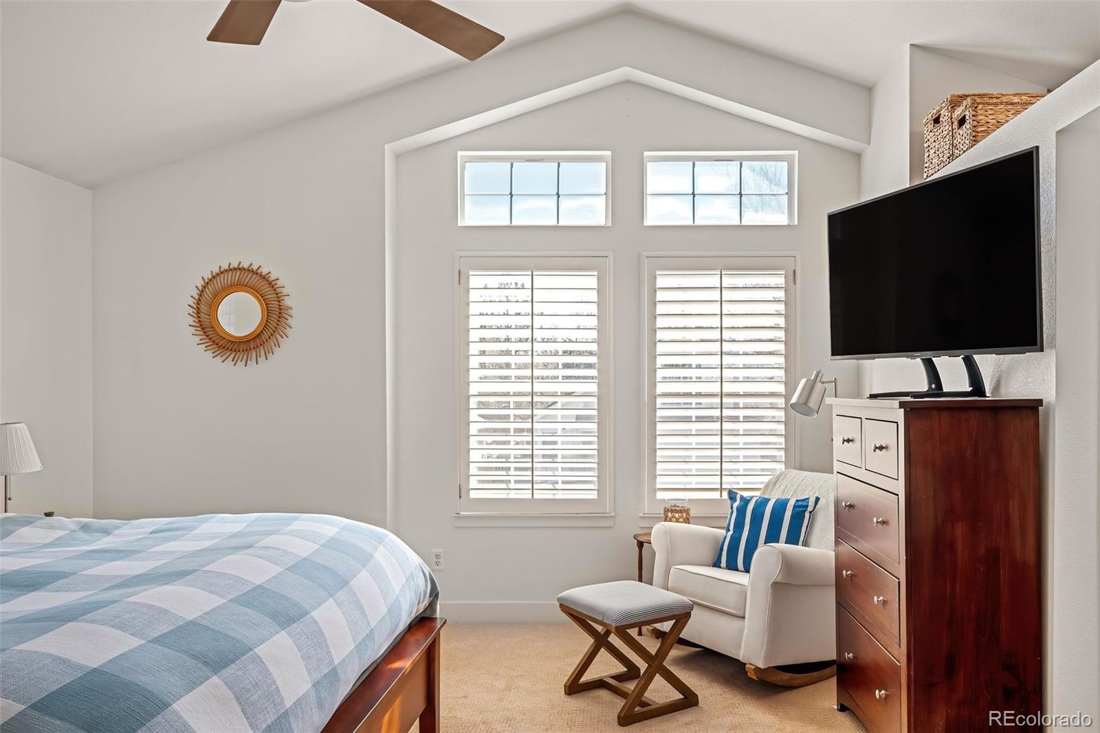 7255 West 97th Place Broomfield, CO 80021 - Photo 27 of 47 a bedroom with a bed and a flat screen tv