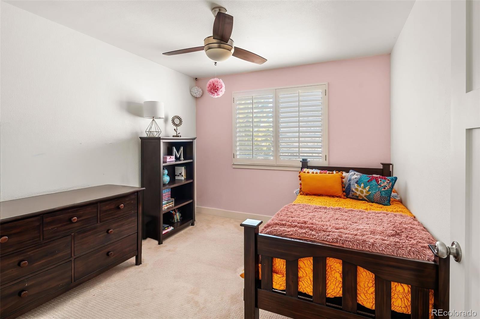 7255 West 97th Place Broomfield, CO 80021 - Photo 33 of 47 a bedroom with a bed and furniture