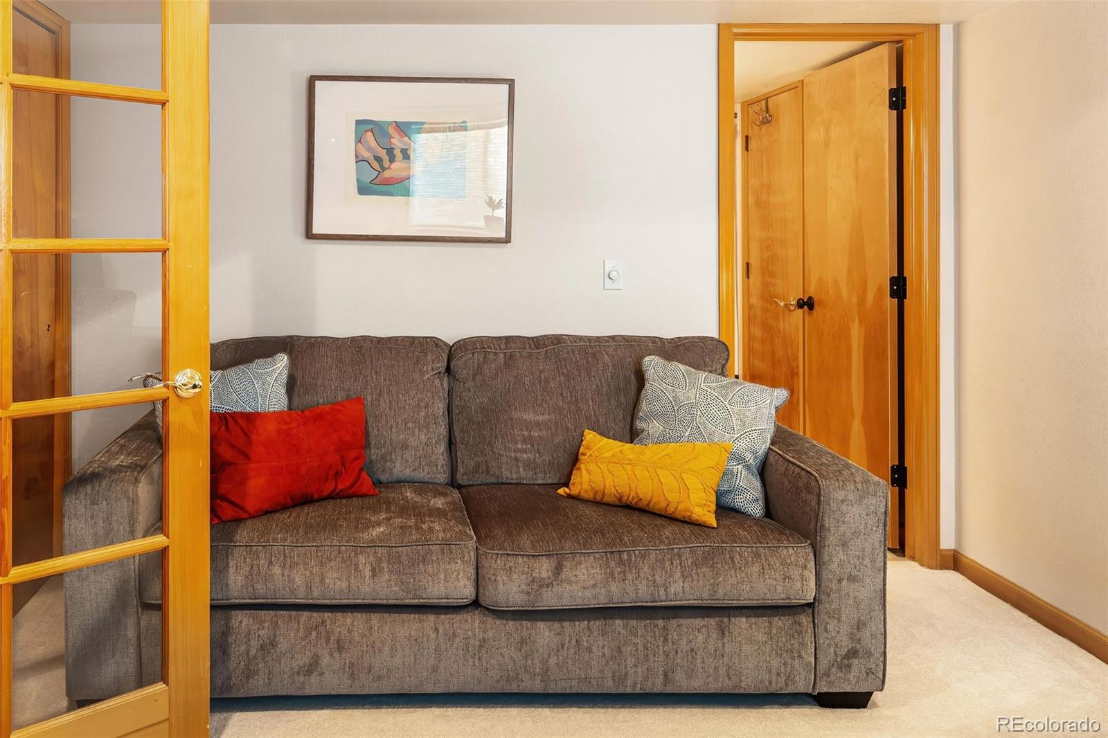 7255 West 97th Place Broomfield, CO 80021 - Photo 40 of 47 a living room with furniture and a bed