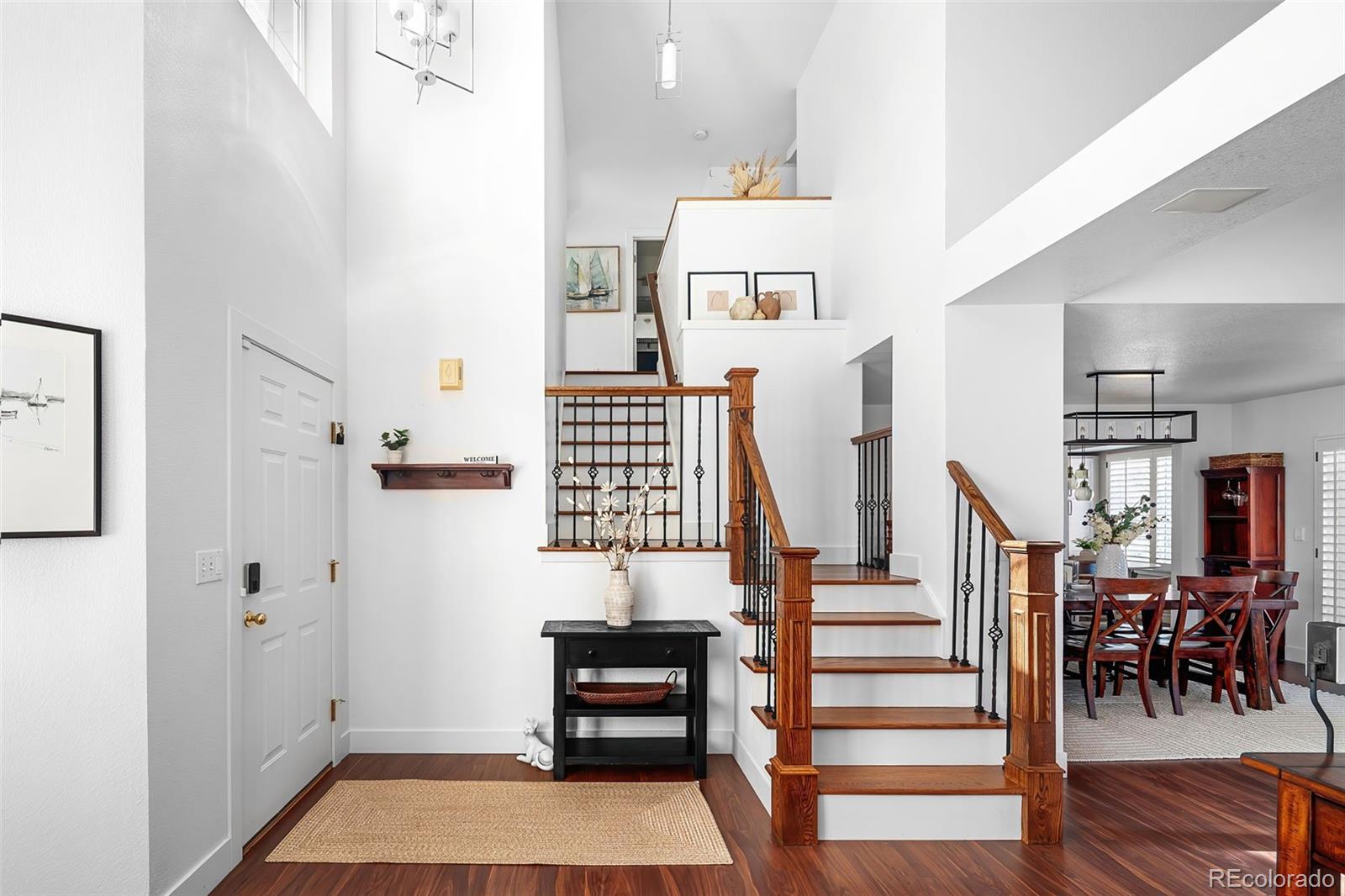 7255 West 97th Place Broomfield, CO 80021 - Photo 4 of 47 a view of entryway and hall with wooden floor