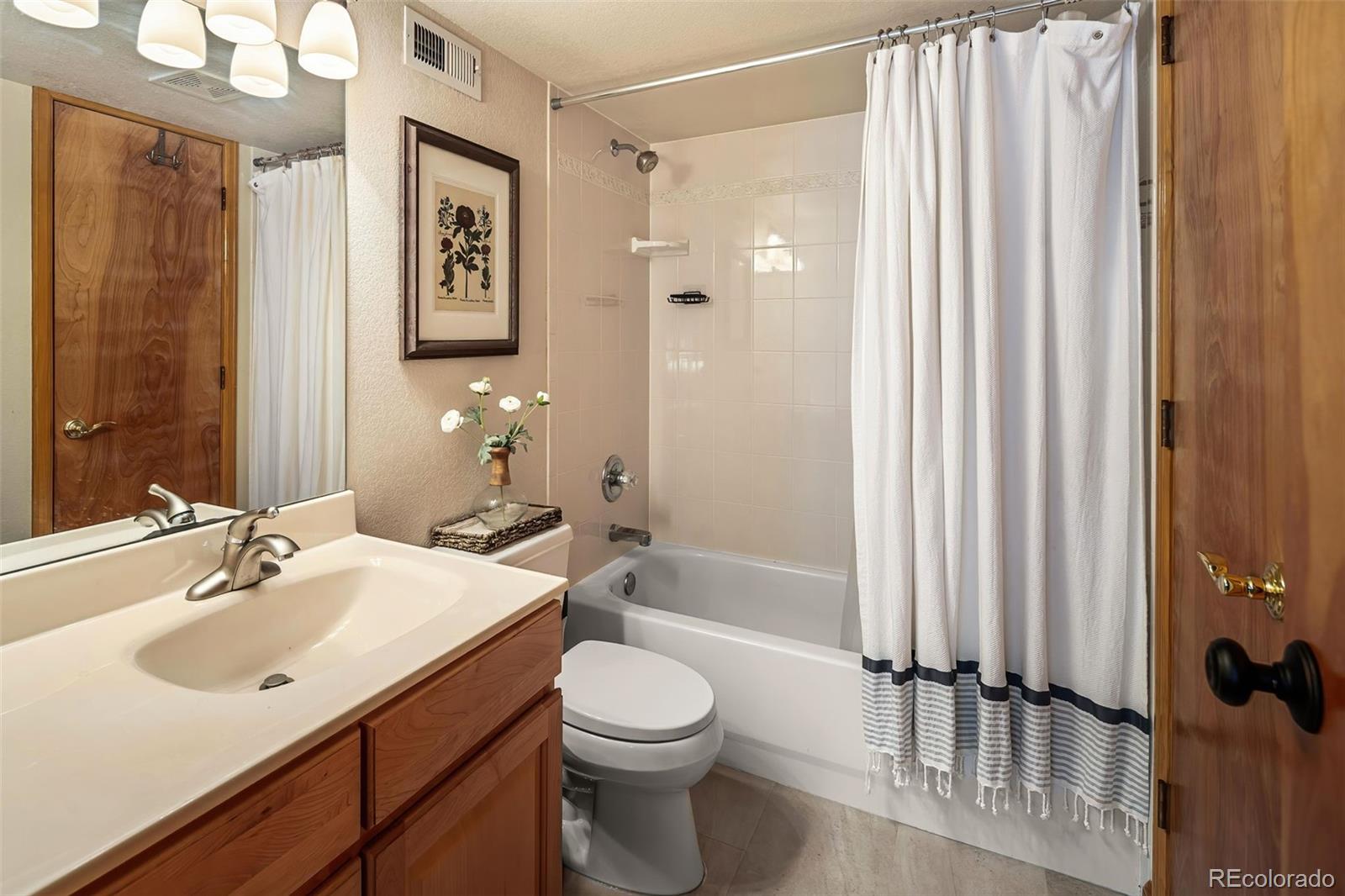7255 West 97th Place Broomfield, CO 80021 - Photo 41 of 47 a bathroom with a sink toilet and shower