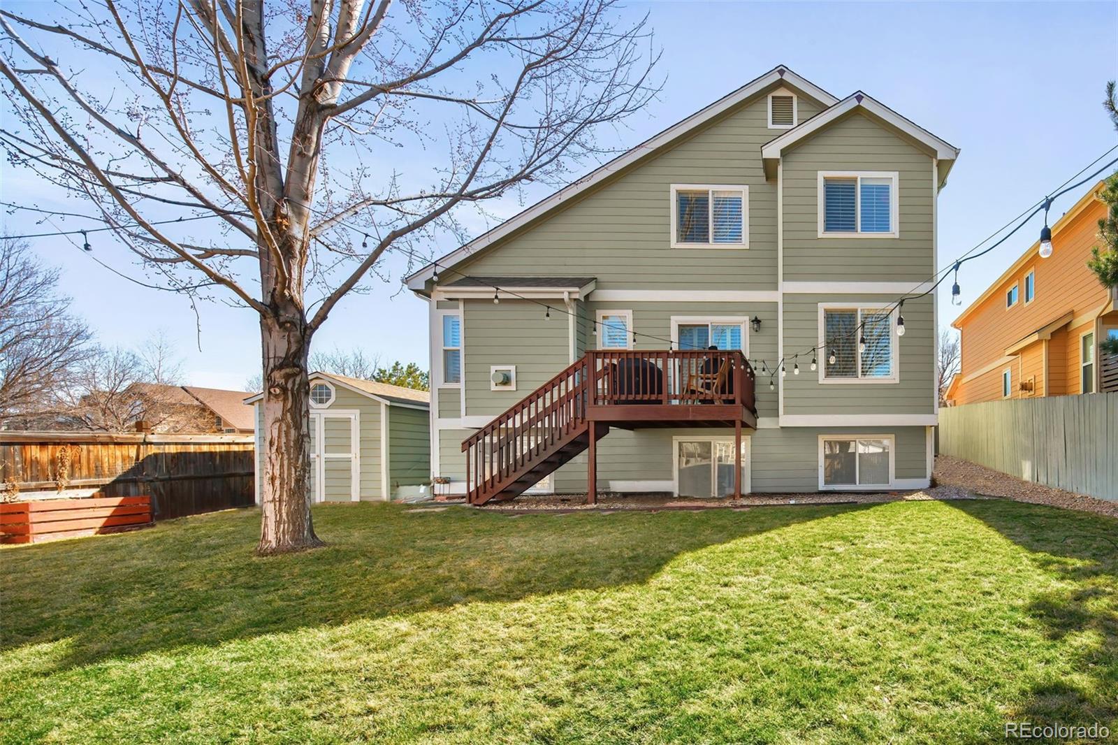 7255 West 97th Place Broomfield, CO 80021 - Photo 43 of 47 a front view of a house with a yard