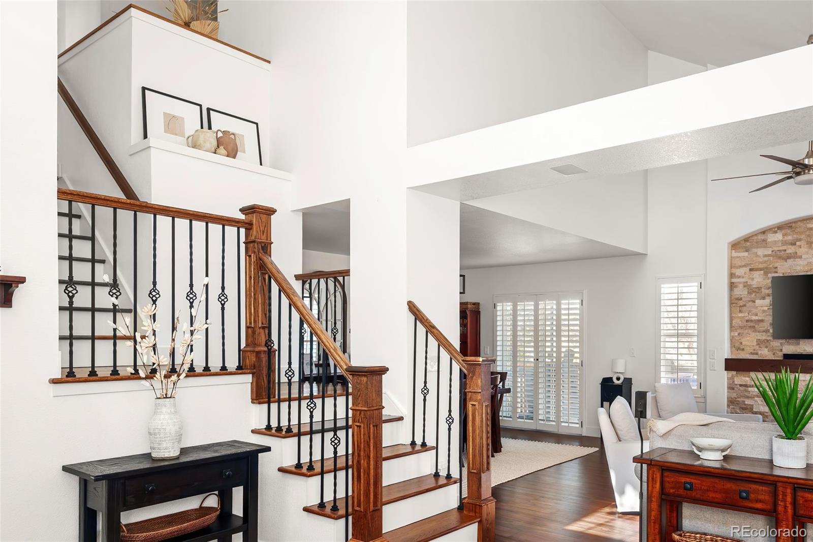 7255 West 97th Place Broomfield, CO 80021 - Photo 7 of 47 a living room with furniture and a wooden floor