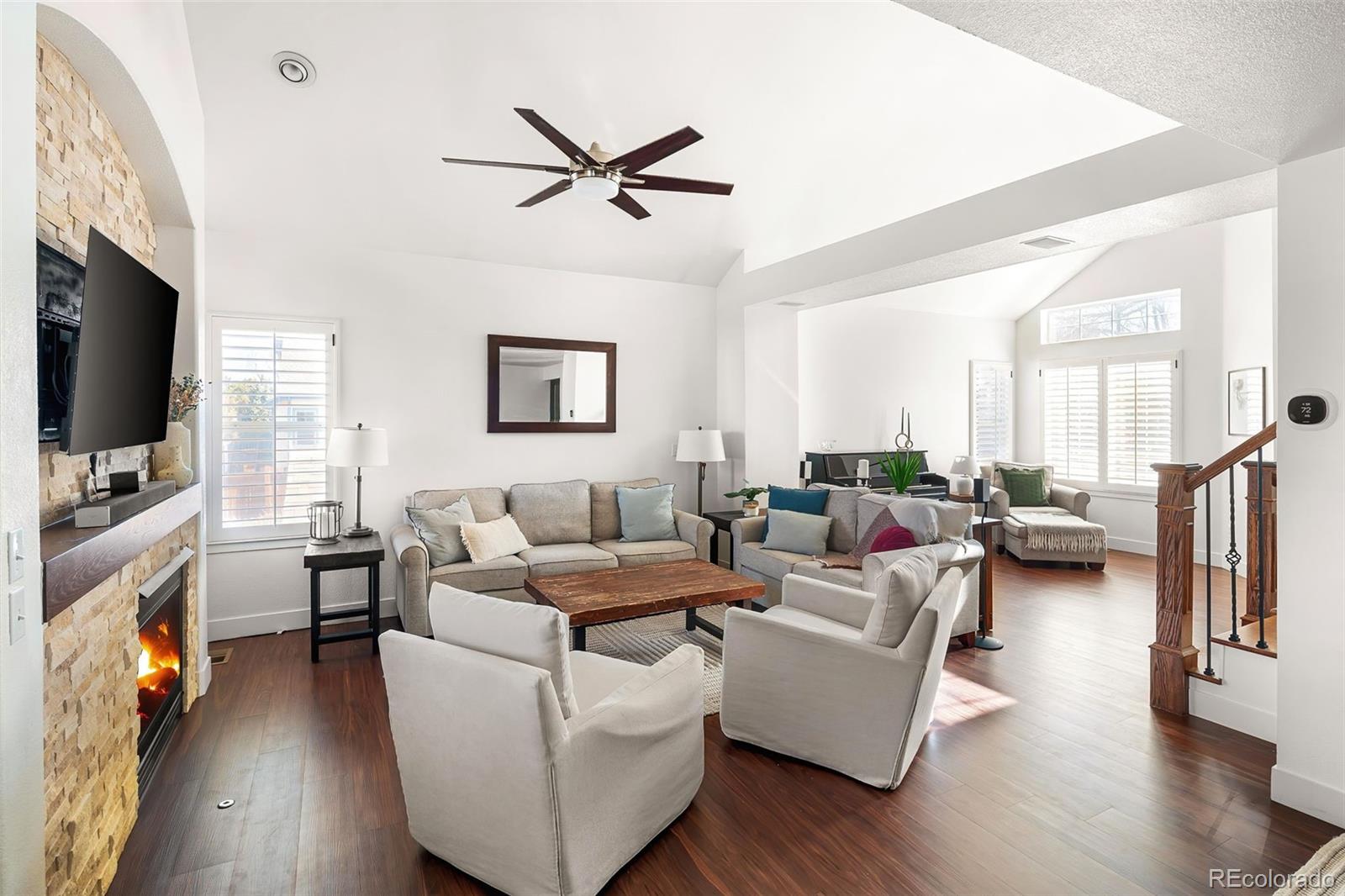 7255 West 97th Place Broomfield, CO 80021 - Photo 9 of 47 a living room with furniture and a flat screen tv