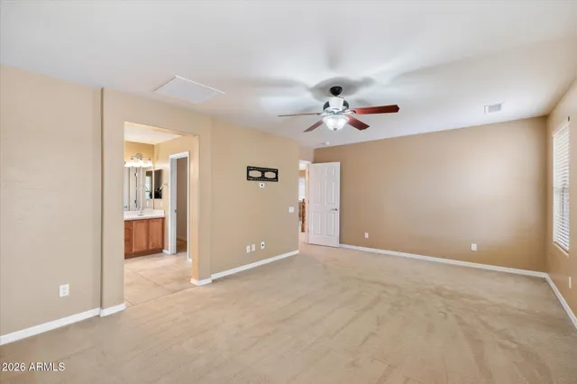 a bathroom with a double vanity sink mirror and bathtub