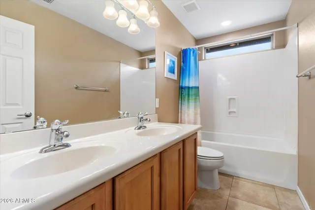 a view of storage and utility room with washer and dryer