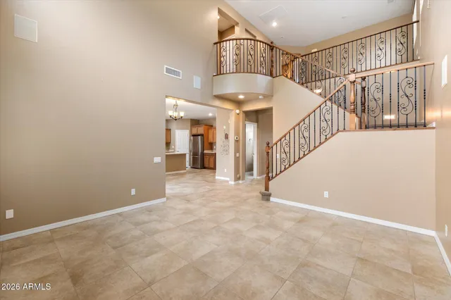 a view of a room with stairs and white walls