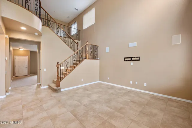 a view of an empty room with windows