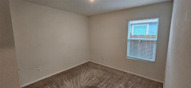 an empty room with a window