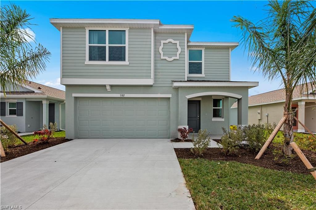 7182 Sugar Pine Way Fort Myers, FL 33966 - Photo 1 of 36 a front view of a house with garden