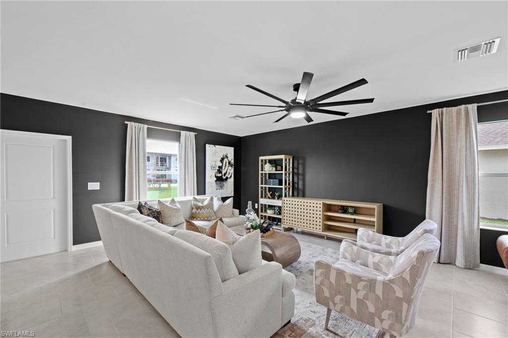 7182 Sugar Pine Way Fort Myers, FL 33966 - Photo 11 of 36 a living room with furniture and a ceiling fan