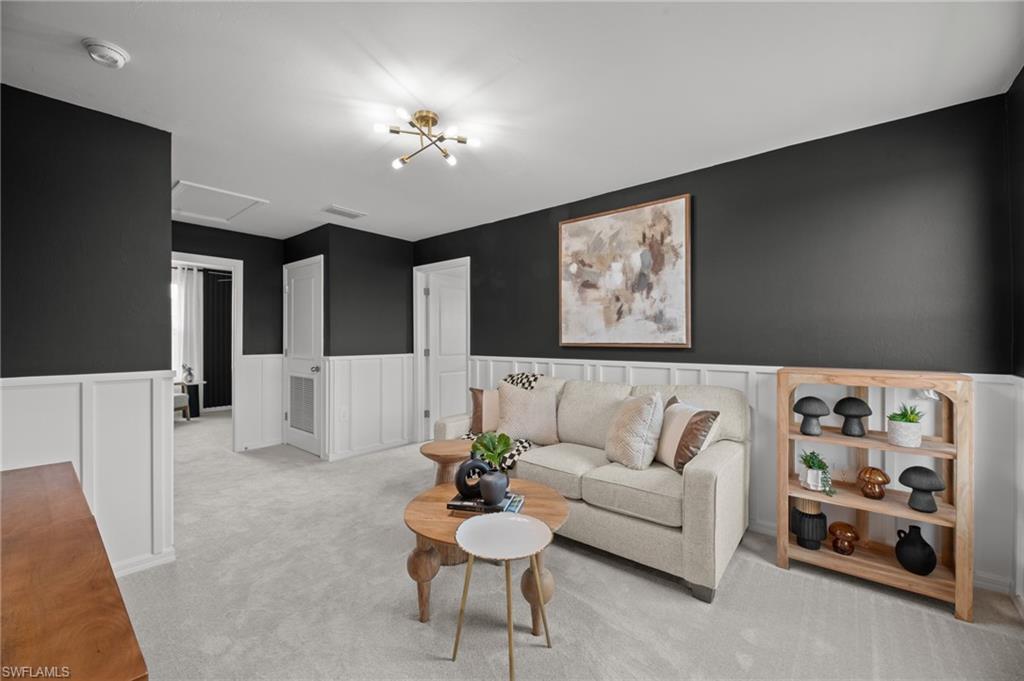 7182 Sugar Pine Way Fort Myers, FL 33966 - Photo 19 of 36 a living room with furniture and a flat screen tv