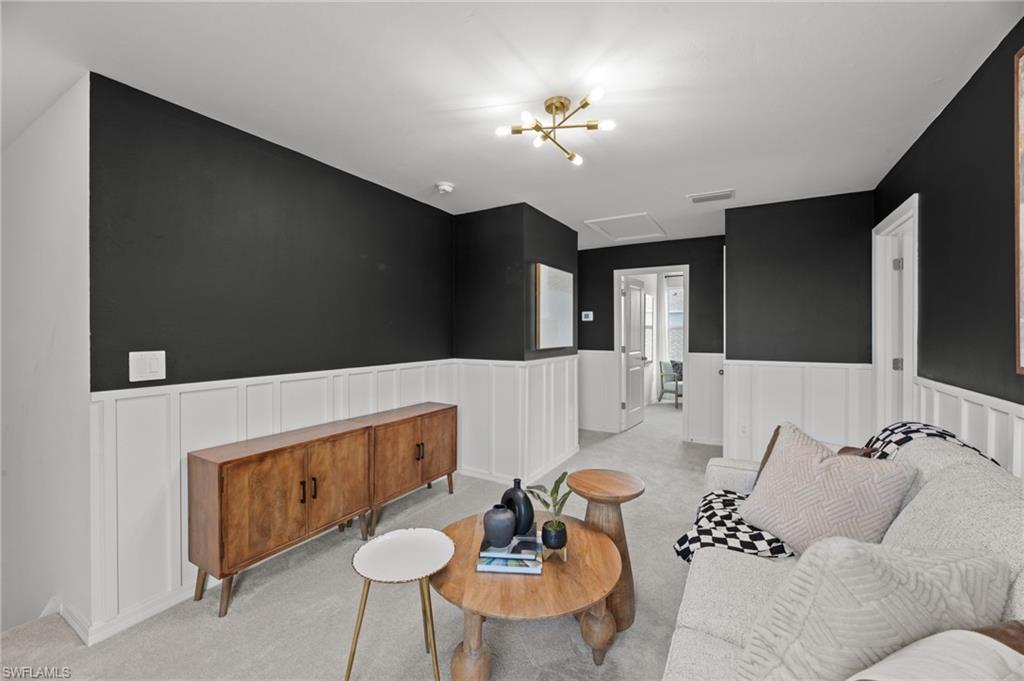 7182 Sugar Pine Way Fort Myers, FL 33966 - Photo 20 of 36 a living room with furniture and a chandelier