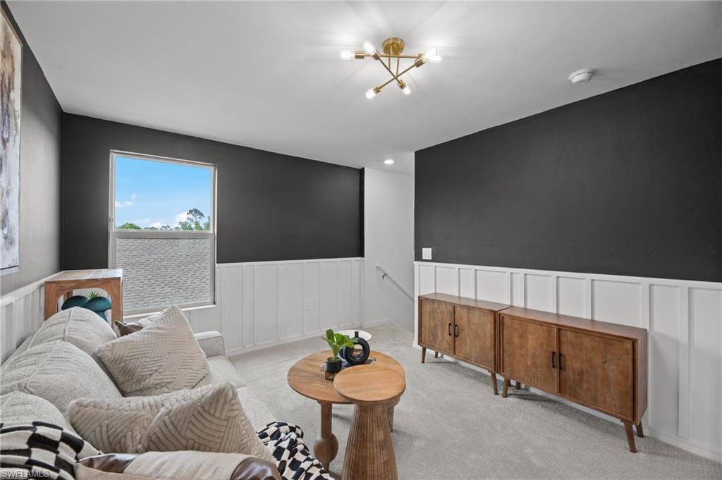 7182 Sugar Pine Way Fort Myers, FL 33966 - Photo 21 of 36 a living room with furniture and a flat screen tv