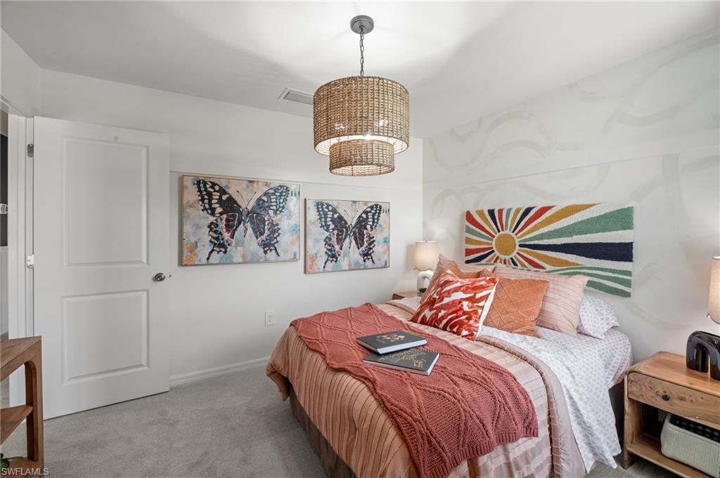 7182 Sugar Pine Way Fort Myers, FL 33966 - Photo 28 of 36 a bedroom with a bed and a painting on the wall