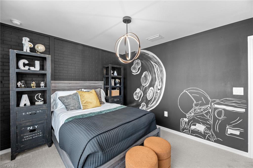 7182 Sugar Pine Way Fort Myers, FL 33966 - Photo 30 of 36 a bedroom with a bed a dresser and book shelf