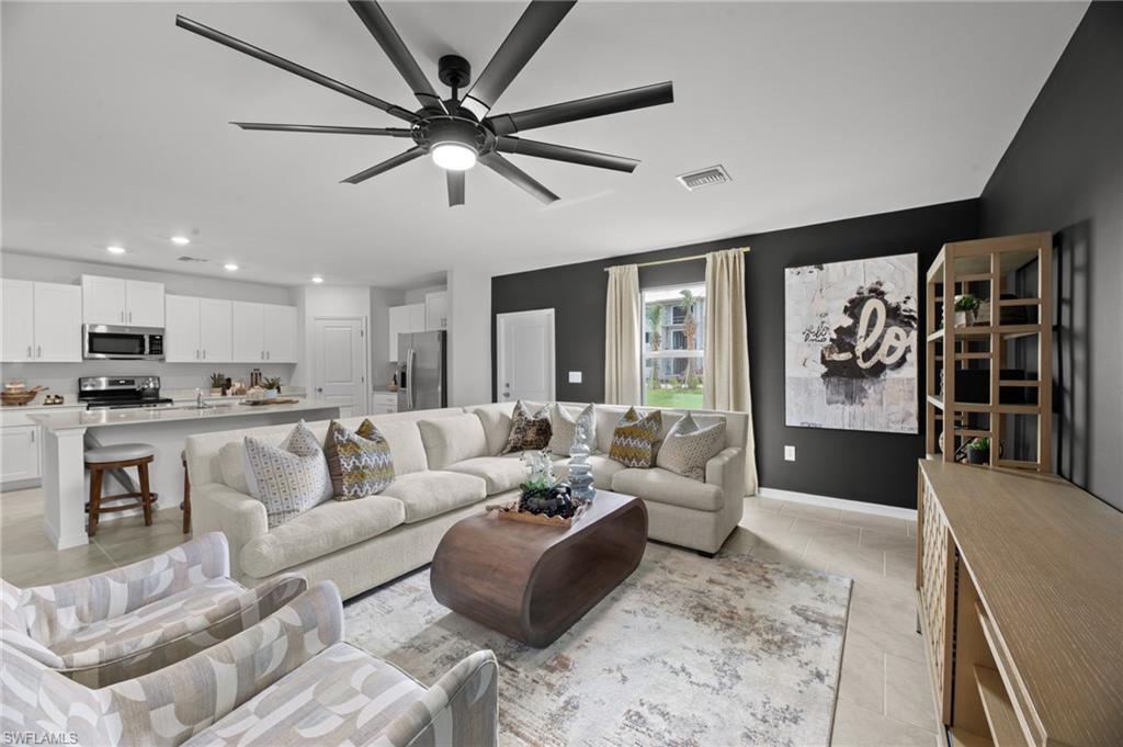 7182 Sugar Pine Way Fort Myers, FL 33966 - Photo 7 of 36 a living room with furniture and kitchen view