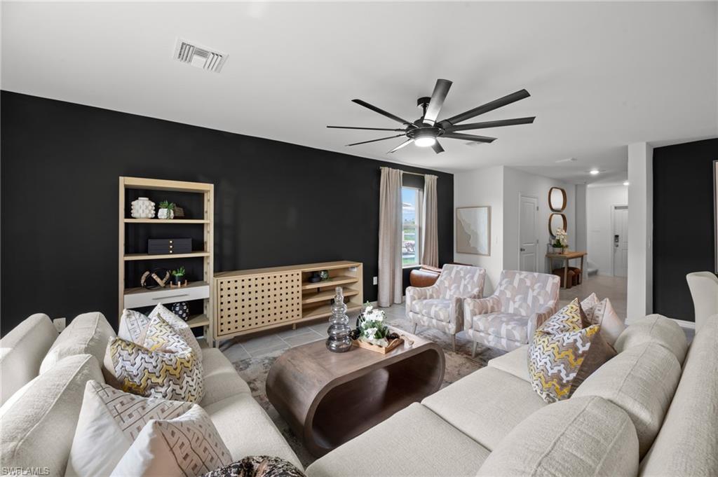 7182 Sugar Pine Way Fort Myers, FL 33966 - Photo 9 of 36 a living room with furniture and a large window