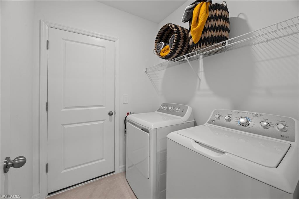 7182 Sugar Pine Way Fort Myers, FL 33966 - Photo 10 of 36 a utility room with dryer and washer