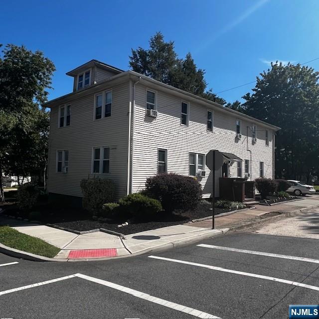 a view of a street with houses on the road