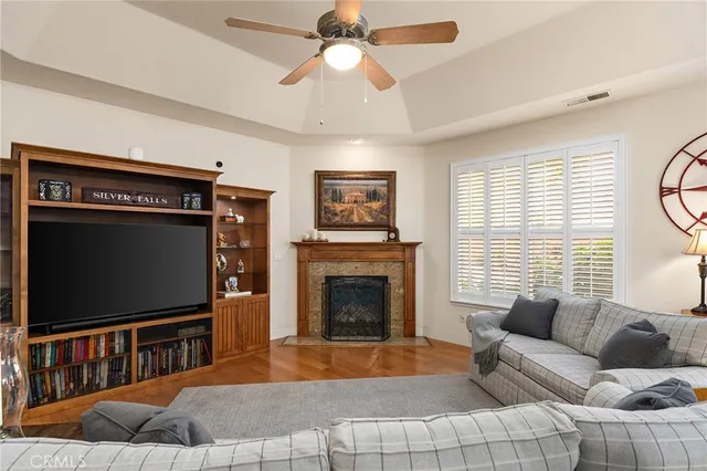 a kitchen with stainless steel appliances granite countertop a stove top oven a sink dishwasher and a refrigerator with cabinets