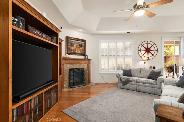 a kitchen with stainless steel appliances a dining table chairs stove and refrigerator
