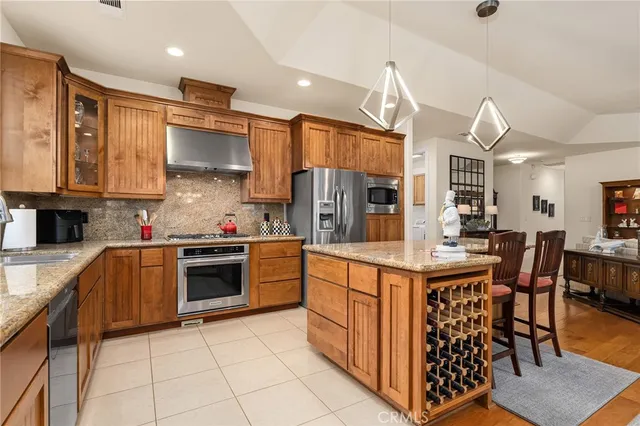 a view of a hallway with a white refrigerator