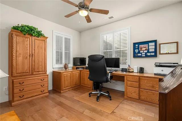 a bathroom with a tub a sink and a window