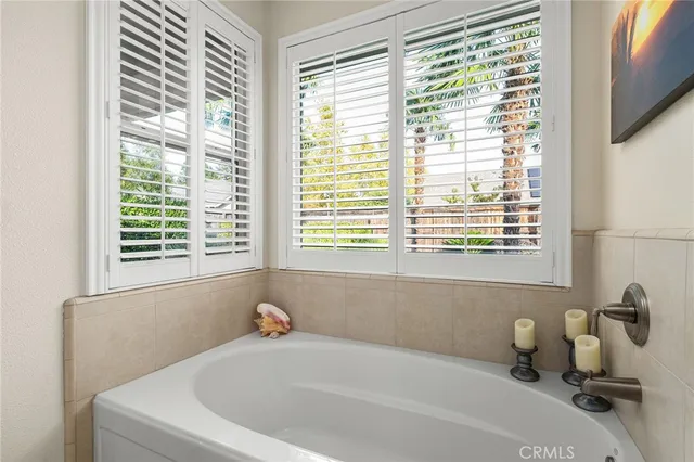 a bathroom with a shower a toilet and a sink