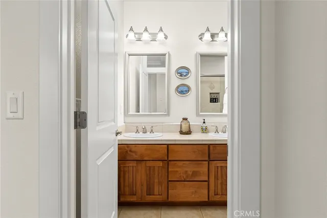 a view of house with yard and lake view