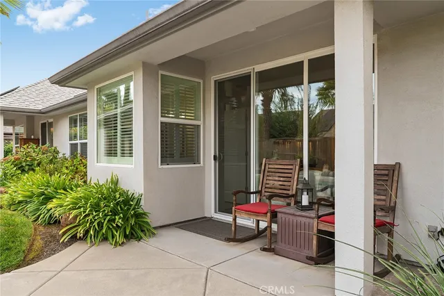 a view of a patio with table and chairs potted plants with wooden floor