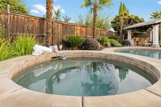 a view of a swimming pool with a patio