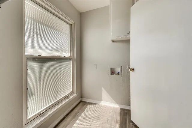 a view of a bathroom that has a glass door and a window