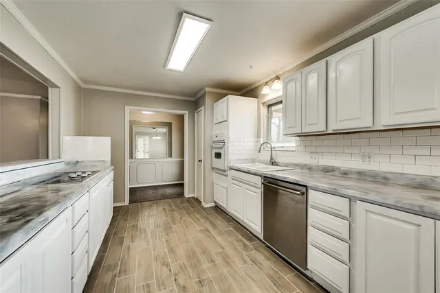 a large kitchen with a stove top oven