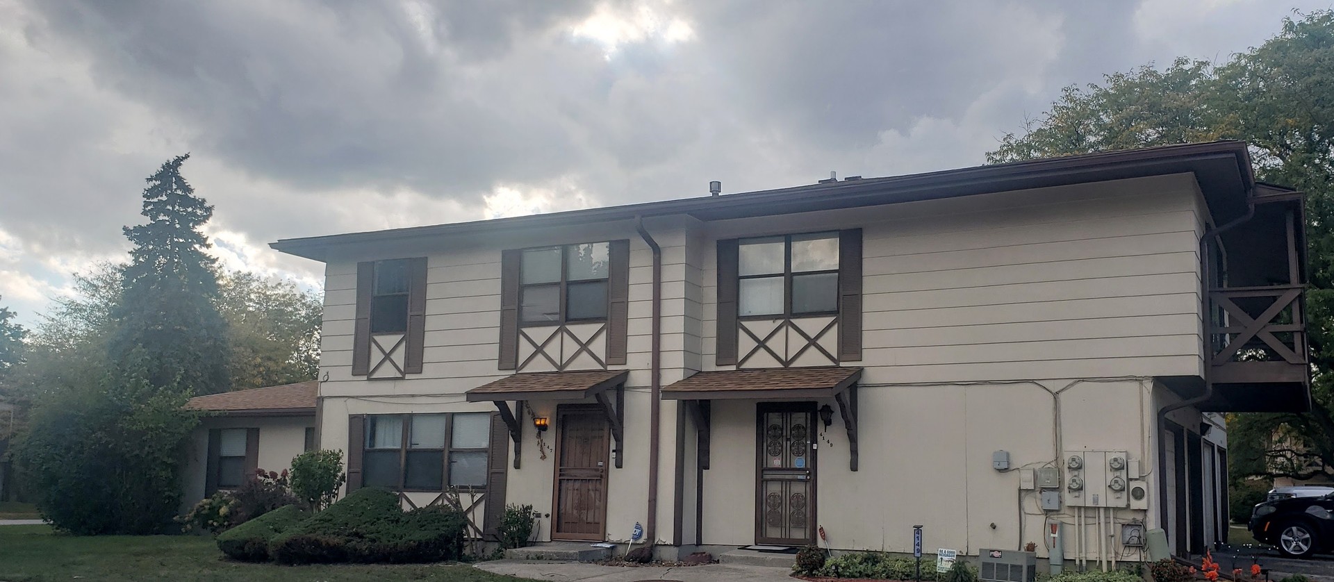 a front view of a house with garden