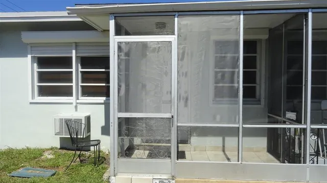 a room with window and a chair