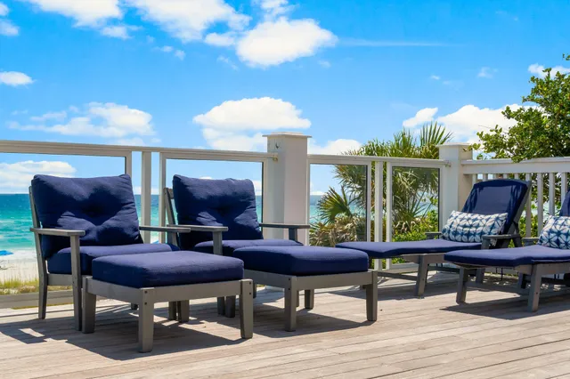 a view of a big yard with an ocean