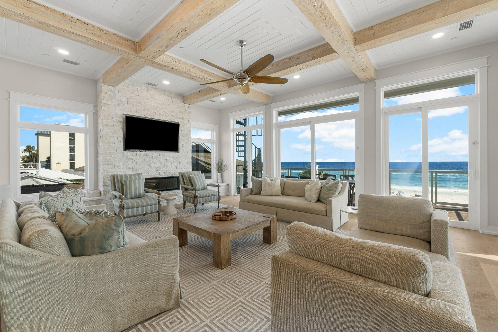 22015 Front Beach Road Panama City Beach, FL 32413 - Photo 19 of 104 a living room with furniture and a flat screen tv