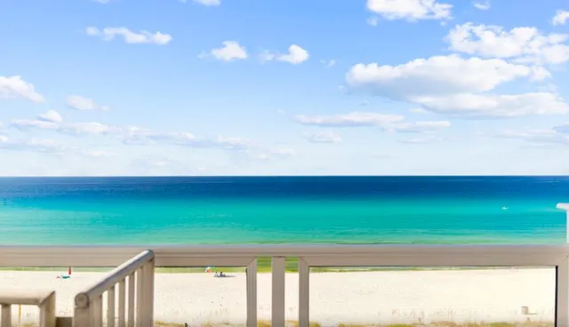a view of a dining room with furniture and window