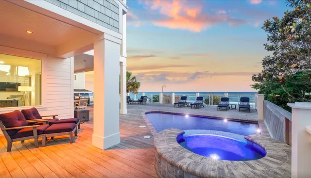 a front view of a building with a garden