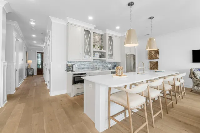 a spacious bedroom with a bed and a flat screen tv