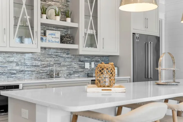 a bathroom with a double vanity sink mirror and shower